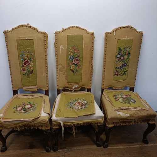 526 - A set of seven Carolean style dining chairs, with padded backs and seats, on carved cabriole legs, t... 