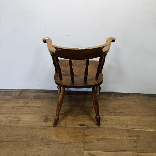 528 - An elm smoker's bow armchair