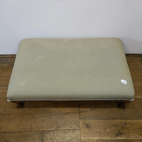 529 - A large footstool, on cabriole legs, 110 cm wide x 69 cm deep x 33 cm high