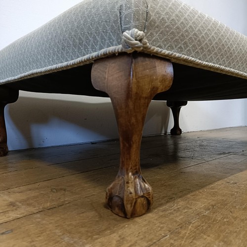 529 - A large footstool, on cabriole legs, 110 cm wide x 69 cm deep x 33 cm high