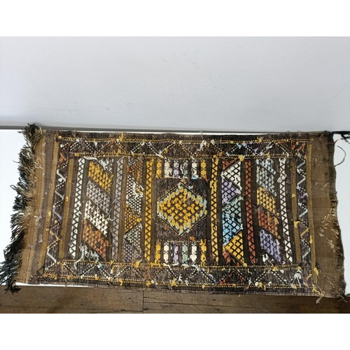 580 - A set of four tribal rugs, with geometric decoration, each 92 x 50 cm (4)