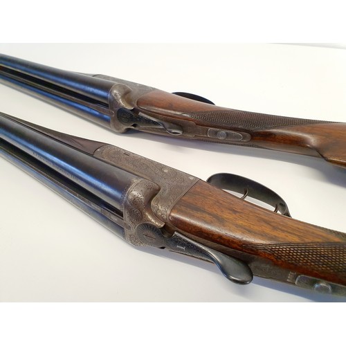 274 - A pair of E J Churchill 20 bore double barrel shotguns, with walnut stocks, in a fitted case. Proven... 