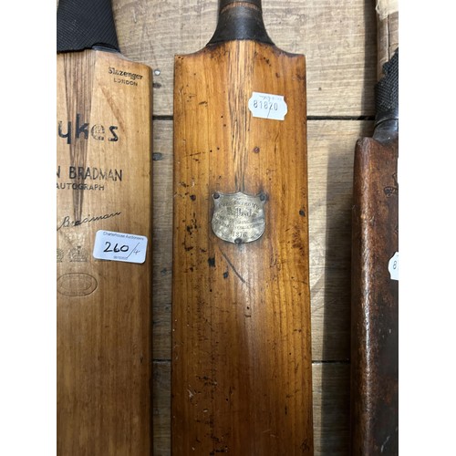 260 - A Slazenger Sykes Don Bradman cricket bat, and three other vintage cricket bats (4)