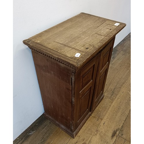 540 - A pine collectors cabinet, with two cupboard doors, to reveal a fitted interior, 53 cm wide