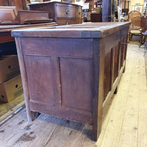 564 - A large oak coffer, with linen fold decoration, 170 cm wide