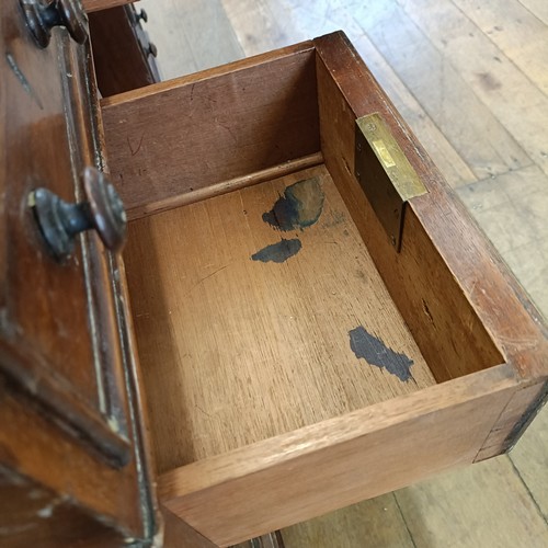 565 - A mahogany pedestal desk, having a nine drawer configuration, 120 cm wide