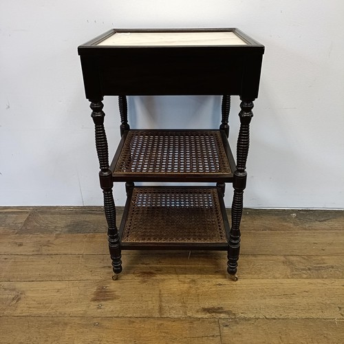 497 - A mahogany two tier bedside table, with a marble top, 43 cm wide