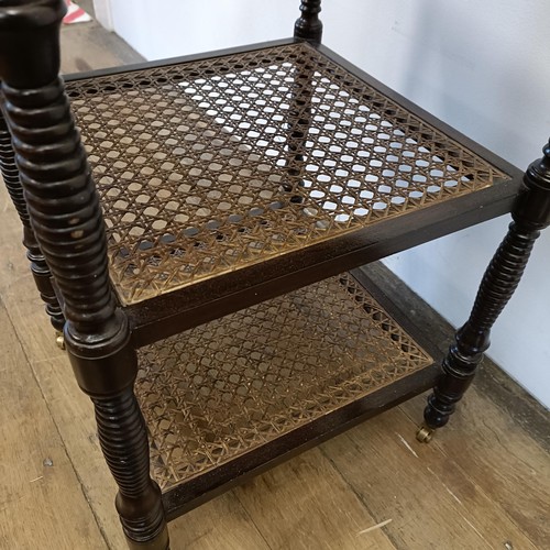 497 - A mahogany two tier bedside table, with a marble top, 43 cm wide