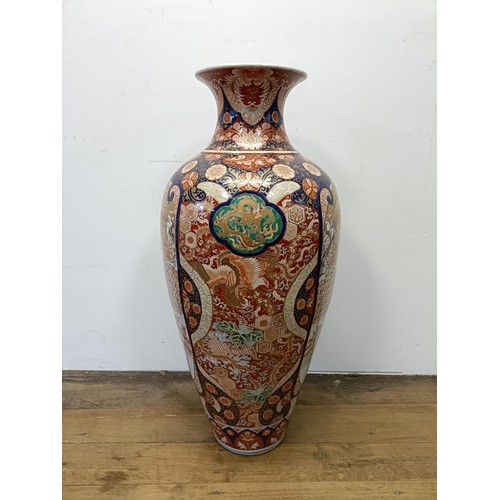 42 - A large Japanese Imari vase, decorated landscape with figures, 90 cm high