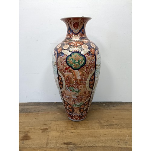 42 - A large Japanese Imari vase, decorated landscape with figures, 90 cm high