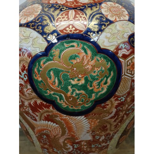 42 - A large Japanese Imari vase, decorated landscape with figures, 90 cm high