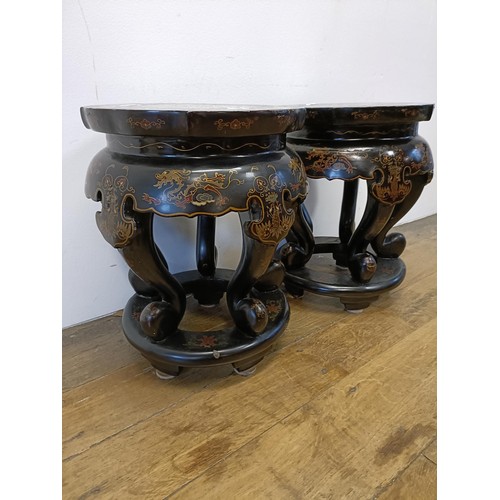 46 - A pair of Chinese lacquered vase stands, decorated dragons, 42 cm high x 33 cm diameter (2)