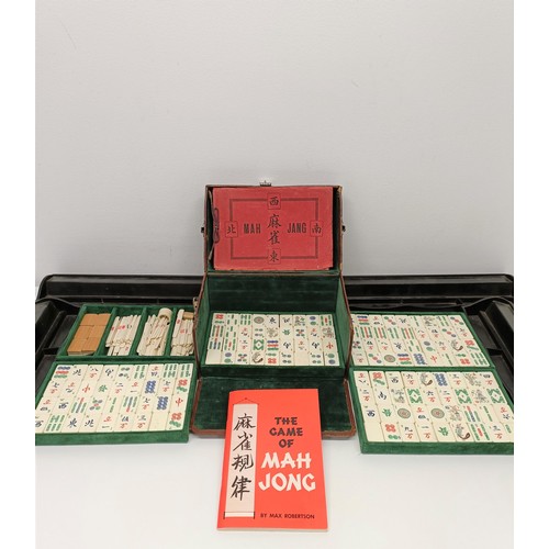 92 - A Mah-Jong set, in a leather case, and four stands (5)