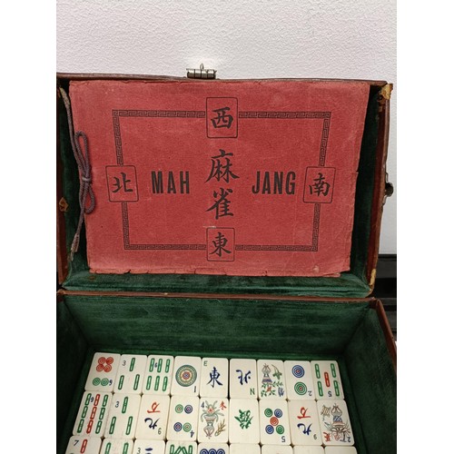 92 - A Mah-Jong set, in a leather case, and four stands (5)