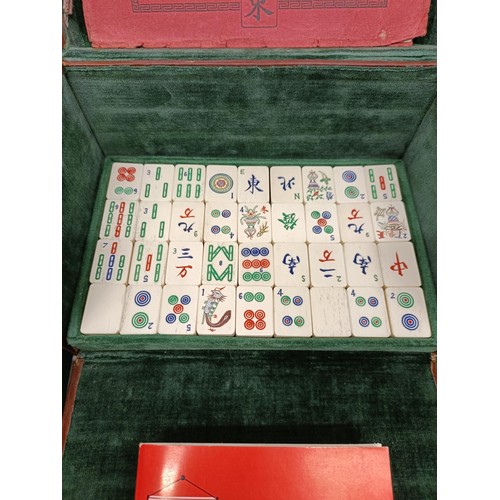 92 - A Mah-Jong set, in a leather case, and four stands (5)