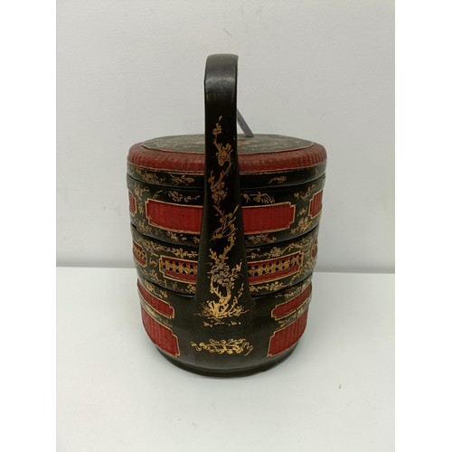 93 - A Chinese lacquered steamer, decorated figures, 30 cm high