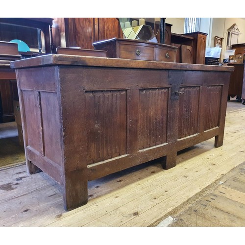 1226 - A large oak coffer, with linen fold decoration, 170 cm wide