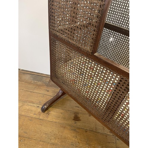 1254 - A 19th century mahogany bergere cot, 100 cm wide