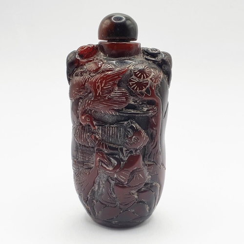 13 - A Chinese carved amber coloured snuff bottle, 7 cm high
Provenance: From a single owner collection o... 