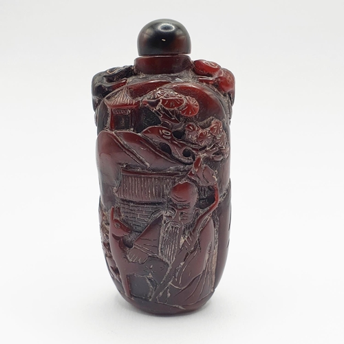 13 - A Chinese carved amber coloured snuff bottle, 7 cm high
Provenance: From a single owner collection o... 