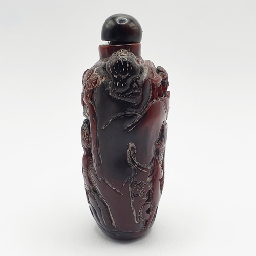 13 - A Chinese carved amber coloured snuff bottle, 7 cm high
Provenance: From a single owner collection o... 