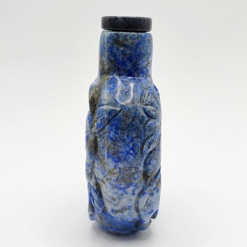 20 - A Chinese carved blue stone snuff bottle, 7 cm high
Provenance: From a single owner collection of sn... 