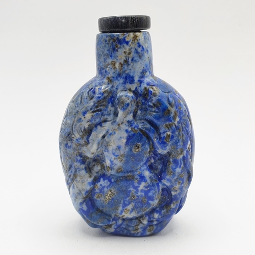 20 - A Chinese carved blue stone snuff bottle, 7 cm high
Provenance: From a single owner collection of sn... 