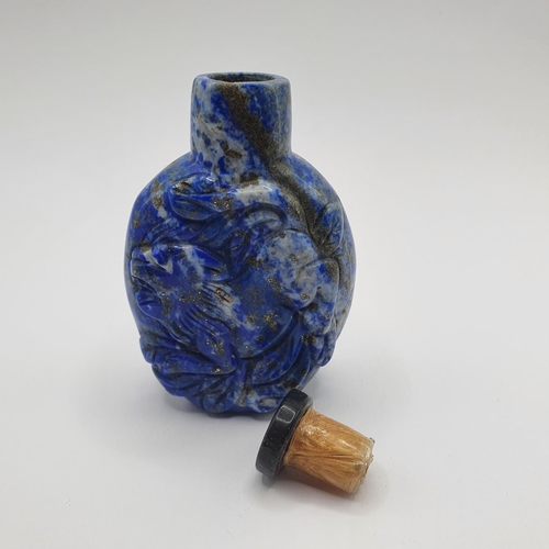 20 - A Chinese carved blue stone snuff bottle, 7 cm high
Provenance: From a single owner collection of sn... 