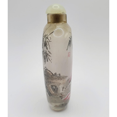 22 - A Chinese glass snuff bottle, the interior painted a figure, 9 cm high 
Provenance: From a single ow... 