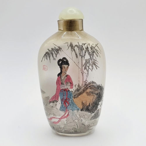 22 - A Chinese glass snuff bottle, the interior painted a figure, 9 cm high 
Provenance: From a single ow... 