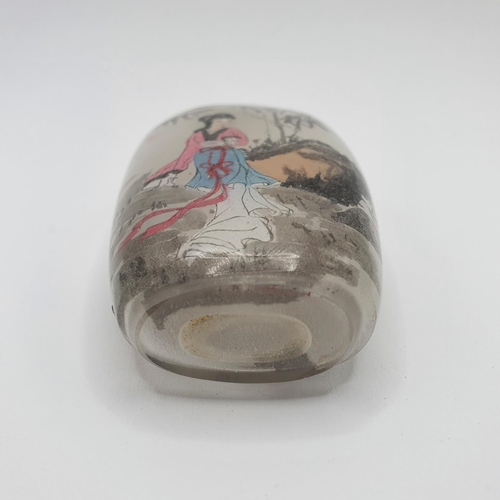 22 - A Chinese glass snuff bottle, the interior painted a figure, 9 cm high 
Provenance: From a single ow... 