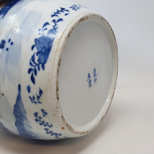 3 - A Chinese blue and white ginger jar, decorated a landscape with a building, character mark to base, ... 