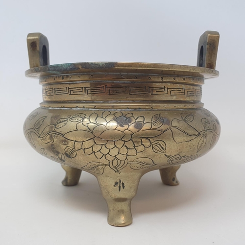 31 - A Chinese bronze censer, decorated birds and flowers, six character mark to base, 16 cm wide