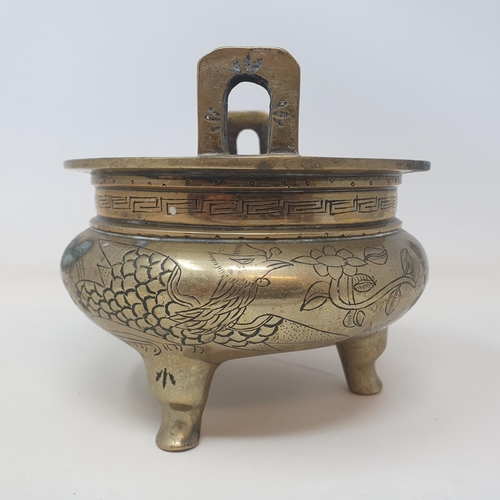 31 - A Chinese bronze censer, decorated birds and flowers, six character mark to base, 16 cm wide