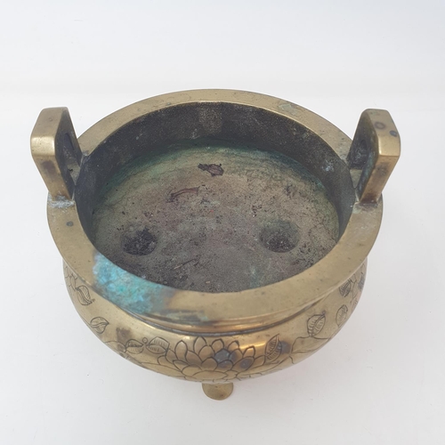 31 - A Chinese bronze censer, decorated birds and flowers, six character mark to base, 16 cm wide