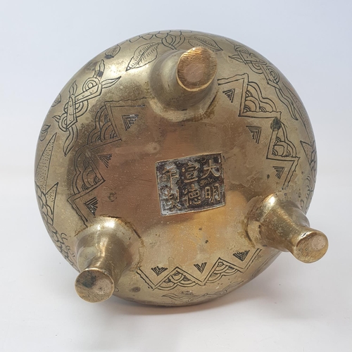 31 - A Chinese bronze censer, decorated birds and flowers, six character mark to base, 16 cm wide