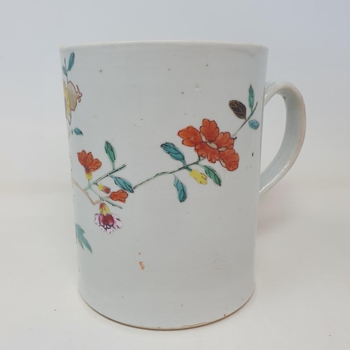 32 - A Chinese famille verte mug, decorated flowers, 14.5 cm high
Provenance: From a Dorset collection