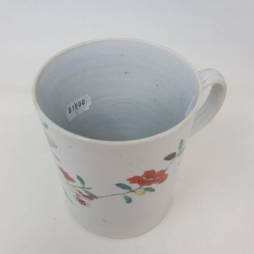 32 - A Chinese famille verte mug, decorated flowers, 14.5 cm high
Provenance: From a Dorset collection