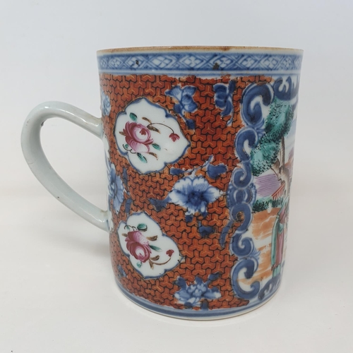 35 - A Chinese export ware mug, decorated figures, 14 cm high  
Provenance:  From a Dorset collection