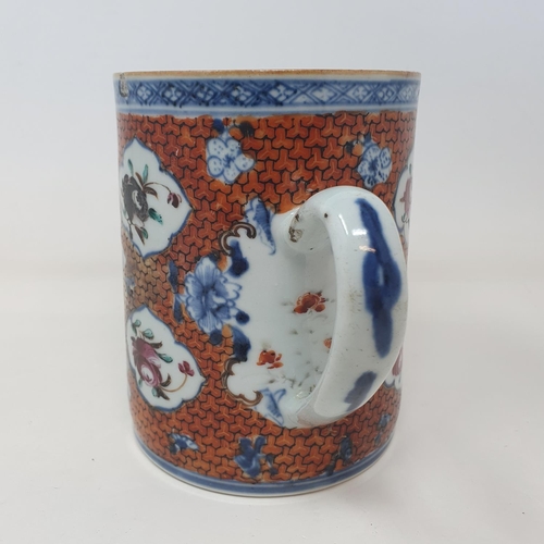 35 - A Chinese export ware mug, decorated figures, 14 cm high  
Provenance:  From a Dorset collection