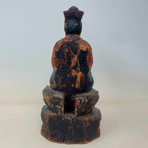 39 - A Chinese carved wood and painted figure of a deity, 27 cm high