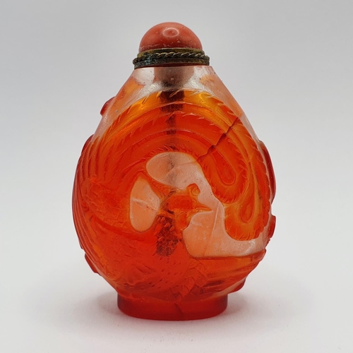 8 - A Chinese red and white cased glass snuff bottle, with a coral stopper, 6 cm high
Provenance: From a... 