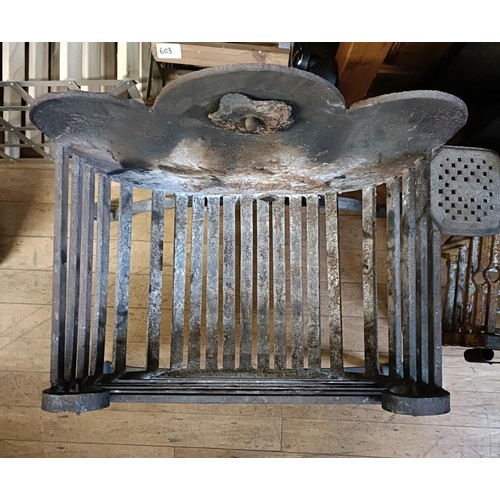 1322 - A pair of cast iron fire dogs, 54 cm high, a cast iron fire basket, 71 cm wide, a cast iron fire bac... 