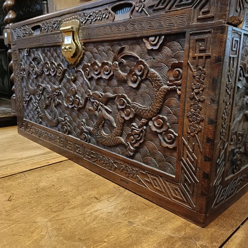 50 - A Chinese camphorwood trunk, decorated dragons, 104 cm