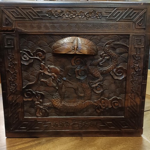 50 - A Chinese camphorwood trunk, decorated dragons, 104 cm