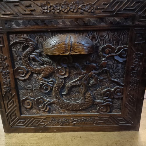 50 - A Chinese camphorwood trunk, decorated dragons, 104 cm