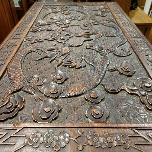 50 - A Chinese camphorwood trunk, decorated dragons, 104 cm