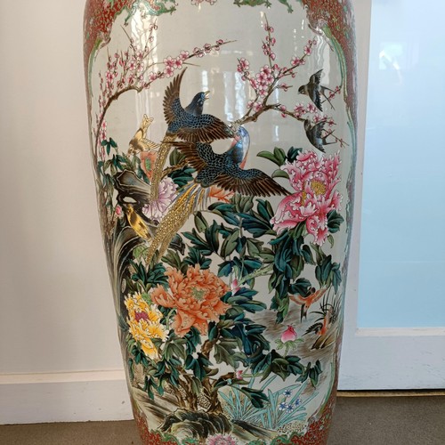 41 - A large pair of Chinese floor vases, of baluster form, decorated flowers and birds in enamel colours... 