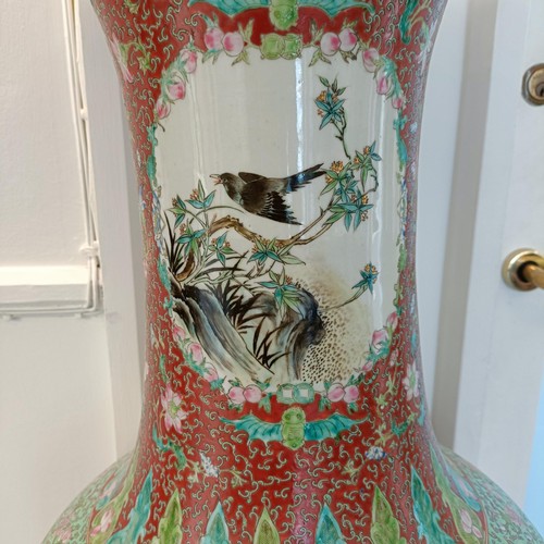 41 - A large pair of Chinese floor vases, of baluster form, decorated flowers and birds in enamel colours... 