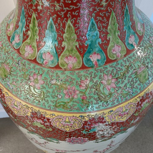 41 - A large pair of Chinese floor vases, of baluster form, decorated flowers and birds in enamel colours... 